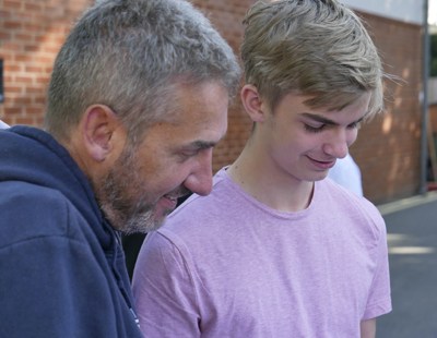 Student Joe Sheridan shows teacher Tim Rushbrooke his amazing GCSE results at Reed